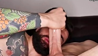 Tattooed bottom gets long cock in his ass