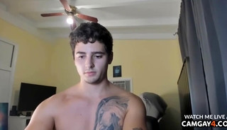 Young muscular man masturbates in the room and ends up ejaculating