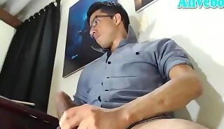 glassesed guy strokes his big fat cock on webcam