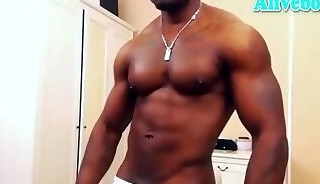 muscle black bodybuilder with tattoos shows off his hot body