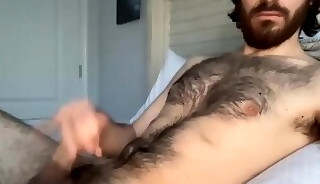 Hairy bearded man playing his dick on webcam