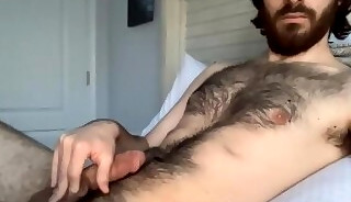 Hairy bearded man playing his dick on webcam