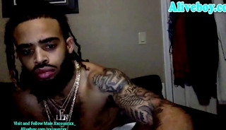 black dude with full tattoos jerks off