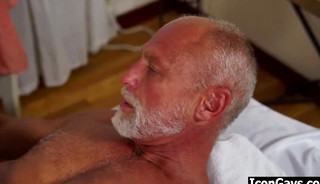 Old gay man puts on cock rings before having massage