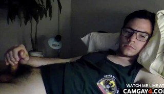 Guy with glasses masturbating with his hairy cock in webcam