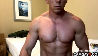 Handsome muscular man stroking his cock in webcam