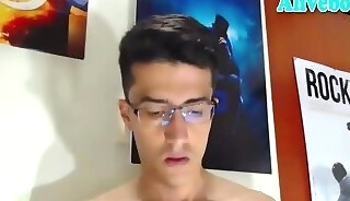 glassesed guy strokes his thick uncut monster cock on webcam