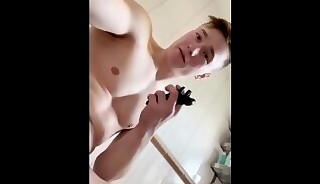sporty guy performs with running shower