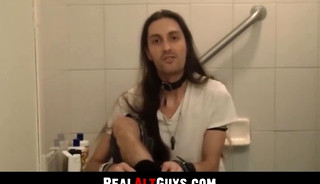 Long-haired stud strokes his cock intensely while relaxing in the bathtub