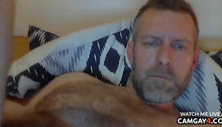 Handsome mature man caressing himself