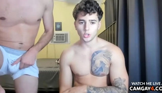 Two guys with tattoos caressing their cocks in webcam