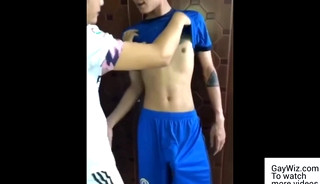 Two Asians wearing soccer uniform have sex. GayWiz.com