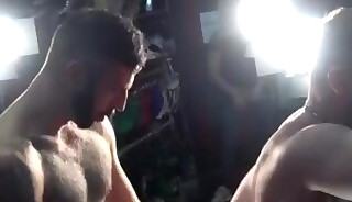 Three studs have bareback fun in a public store - Behind the scenes video