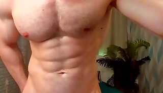 Muscular gay guy shows off his statuesque body