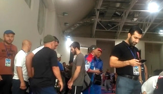 Middle Eastern Guys Weigh in before Wrestling Tournamen