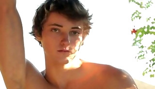 Smooth athletic newbie jerking on bed during solo action