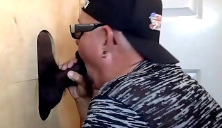 Gloryhole mature DILF teasing balls and blowing black cocks