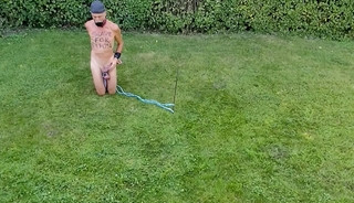 naked pathetic slave during outdoor party, handcuffed, jumps around