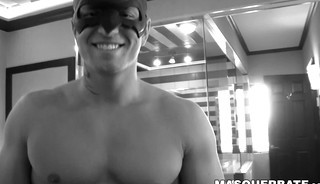 Masked muscular homo strokes his cock and strips naked