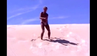 Tanned guy on beach in tiny string thong (temporarily!)