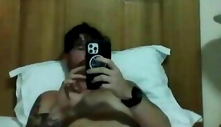 Carefree and tattooed guy in his masturbation