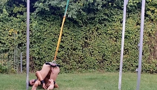 naked slave pig exposed outdoor party, handcuffed, testicles in humbler, BDSM CBT