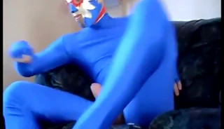 dude in mask a blue zentia suit strokes his big cock