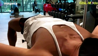 Asian fitness guy exercising in the gym and gets pecs worship!