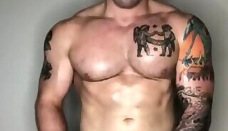 Jordan with a shaved body gets oiled up and jerks off