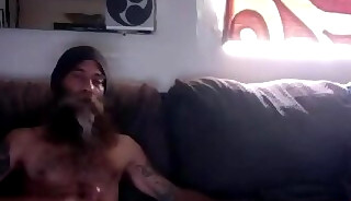 Mature guy masturbating by the window