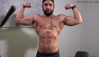 Bearded guy Zack Lemec shows off his muscles during jerk off