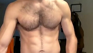 Hairy muscular man jerking off