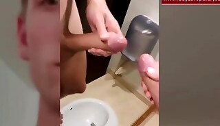 German teen jerks off a huge Dick in the toilet and cums on the mirror