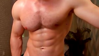 Muscular gay guy shows off his statuesque body